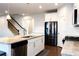 Island kitchen with granite countertops and stainless steel appliances at 5482 Fountainhead Ln, Auburn, GA 30011