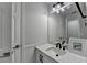 The bathroom features a mirror, vanity, and modern fixtures at 5915 Masters Club Dr, Suwanee, GA 30024