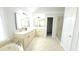 Elegant bathroom with double vanity, soaking tub and separate shower at 5915 Masters Club Dr, Suwanee, GA 30024