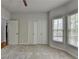 Light and airy bedroom with carpet, large windows, and a ceiling fan at 5915 Masters Club Dr, Suwanee, GA 30024