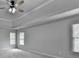 Spacious main bedroom with trey ceiling, fan, and bright natural light at 5915 Masters Club Dr, Suwanee, GA 30024