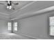 Spacious main bedroom with trey ceiling, fan, and bright natural light at 5915 Masters Club Dr, Suwanee, GA 30024