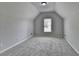Bedroom featuring slanted ceiling and window at 5915 Masters Club Dr, Suwanee, GA 30024