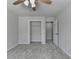 This bedroom offers a ceiling fan, carpeted floor, and closet at 5915 Masters Club Dr, Suwanee, GA 30024