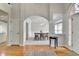 Spacious foyer with hardwood floors, chandelier lighting, and view into the dining room at 5915 Masters Club Dr, Suwanee, GA 30024