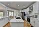 Modern kitchen with stainless steel appliances, island, and granite counters at 5915 Masters Club Dr, Suwanee, GA 30024