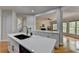 Open concept kitchen with marble countertops and stainless steel appliances at 5915 Masters Club Dr, Suwanee, GA 30024