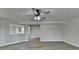 Spacious living room with light-colored walls and hardwood floors at 5915 Masters Club Dr, Suwanee, GA 30024
