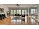 Bright living room with fireplace, hardwood floors, and many windows at 5915 Masters Club Dr, Suwanee, GA 30024
