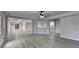 Open-concept living room featuring hard surface floors at 5915 Masters Club Dr, Suwanee, GA 30024