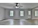 Open concept living area with windows and a door at 5915 Masters Club Dr, Suwanee, GA 30024