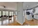 Open-concept kitchen and living room with hardwood floors and ample natural light at 5915 Masters Club Dr, Suwanee, GA 30024