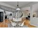 Open concept dining area seamlessly connects to the kitchen and living room, perfect for entertaining at 5915 Masters Club Dr, Suwanee, GA 30024