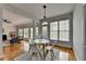Open floor plan seamlessly connects the dining area and living room, filled with natural light at 5915 Masters Club Dr, Suwanee, GA 30024