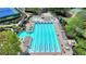 Aerial shot of a community swimming pool area with a large lap pool, a recreational pool, and ample seating at 5915 Masters Club Dr, Suwanee, GA 30024