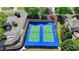 Aerial view of tennis courts with lush green surroundings in a well-maintained community complex at 5915 Masters Club Dr, Suwanee, GA 30024