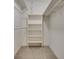 Large walk-in closet with built-in shelving and hanging rods at 1523 Country Squire Ct, Decatur, GA 30033