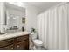 Clean bathroom with granite vanity and white shower curtain at 220 Gucci Cir, Stockbridge, GA 30281