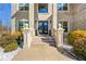 Elegant entryway with double doors and brick staircase at 220 Gucci Cir, Stockbridge, GA 30281