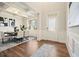 Elegant dining room with hardwood floors and a modern chandelier at 311 Overlook Ridge Ct, Holly Springs, GA 30114