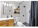 Modern bathroom with subway tile shower, floating shelves, and vanity at 8316 Glenwoods Dr, Riverdale, GA 30274