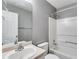 Clean bathroom with a shower/tub combo and vanity at 833 Revena Dr, Austell, GA 30168