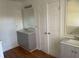 Updated bathroom with double vanity and gray cabinets at 11564 Holly Ln, Hampton, GA 30228