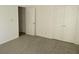 Spacious bedroom with carpet, double doors, and access to another room at 11564 Holly Ln, Hampton, GA 30228