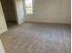Large bedroom with wall-to-wall carpet and a sizable closet at 11564 Holly Ln, Hampton, GA 30228