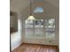 Dining area with bay window and hardwood floors at 11564 Holly Ln, Hampton, GA 30228