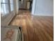 Hardwood floors in a light and airy hallway at 11564 Holly Ln, Hampton, GA 30228