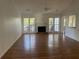 Bright living room with hardwood floors and a fireplace at 11564 Holly Ln, Hampton, GA 30228