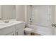 A clean, bright bathroom with a white vanity and tub/shower combination at 405 Westmarch Cir, Loganville, GA 30052