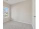 Bedroom with light gray walls, carpeted floors, a white door, and window at 405 Westmarch Cir, Loganville, GA 30052