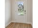 Entry door with clear glass window revealing a view of the exterior at 405 Westmarch Cir, Loganville, GA 30052