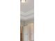Hallway featuring a light fixture and two doors, with white trim at 405 Westmarch Cir, Loganville, GA 30052