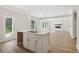 Bright, modern kitchen with island sink, stainless steel faucet, and open floor plan at 405 Westmarch Cir, Loganville, GA 30052