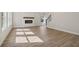 Spacious living room with a fireplace and staircase with iron railing detail at 405 Westmarch Cir, Loganville, GA 30052