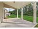 Covered patio with an outdoor space overlooking the green backyard at 405 Westmarch Cir, Loganville, GA 30052