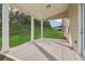 Covered patio overlooking the backyard with a grassy area at 405 Westmarch Cir, Loganville, GA 30052