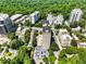 Aerial view showcases the building's pool, parking, and surrounding lush greenery at 2479 Peachtree Ne Rd # 407, Atlanta, GA 30305