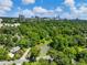 Breathtaking aerial view of lush greenery, a serene pond, and the stunning city skyline in the distance at 2479 Peachtree Ne Rd # 407, Atlanta, GA 30305