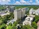 Scenic aerial view of a high rise condominium complex surrounded by lush greenery and cityscape at 2479 Peachtree Ne Rd # 407, Atlanta, GA 30305