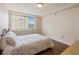 Bedroom features hardwood floors, a large window, and neutral paint at 2479 Peachtree Ne Rd # 407, Atlanta, GA 30305