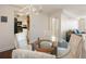 Bright dining area featuring a glass table with seating for four, with a view of the living room and kitchen at 2479 Peachtree Ne Rd # 407, Atlanta, GA 30305