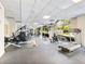 Well-equipped gym with treadmills, rowing machine, and weight machines, and a wall of windows for a bright workout space at 2479 Peachtree Ne Rd # 407, Atlanta, GA 30305