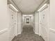 Hallway view highlighting symmetrical doors and carpeted flooring at 2479 Peachtree Ne Rd # 407, Atlanta, GA 30305