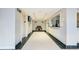Hallway with elevators and a reception area, featuring tile flooring and modern lighting at 2479 Peachtree Ne Rd # 407, Atlanta, GA 30305