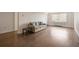 Spacious living room with hardwood floors, a comfortable couch, and bright natural light from the window at 2479 Peachtree Ne Rd # 407, Atlanta, GA 30305