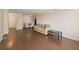 Open living room with hardwood floors, a comfortable sofa, and a view into the dining area at 2479 Peachtree Ne Rd # 407, Atlanta, GA 30305